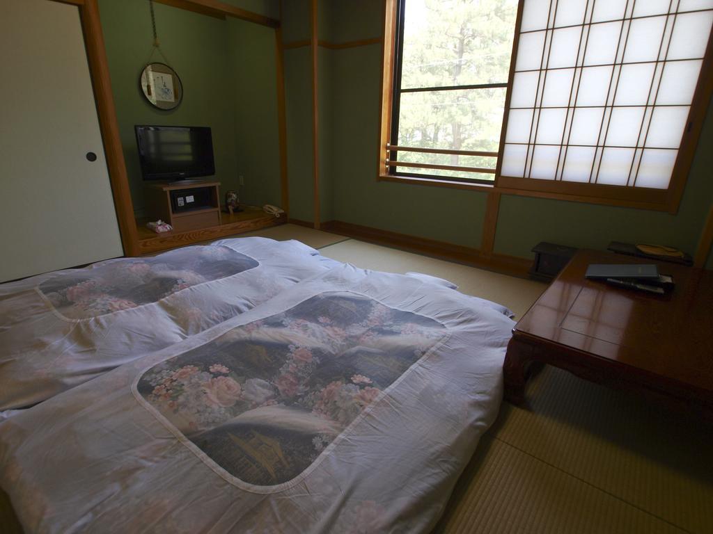 Отель Sazu Onsen Yusho Ками Номер фото